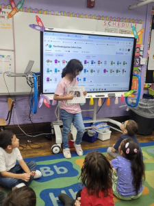 girl holding a sheet of paper